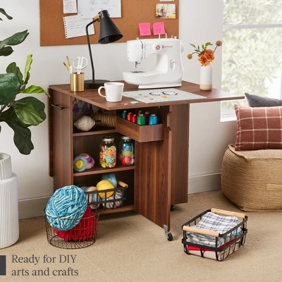 Best Choice Products Multipurpose Folding Table W/ Built-in Wheels, 3 Storage Shelves, Cubby, Carrying Handle - Image 2